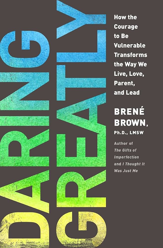 Book cover of "Daring Greatly" by Brené Brown. The title "DARING GREATLY" is prominently displayed in large, colorful letters (blue and green) on a dark background. Below the title, the subtitle reads, "How the Courage to Be Vulnerable Transforms the Way We Live, Love, Parent, and Lead." The author's name, "Brené Brown, Ph.D., LMSW," appears beneath the subtitle. There is a note stating "Author of The Gifts of Imperfection and I Thought It Was Just Me" at the bottom.